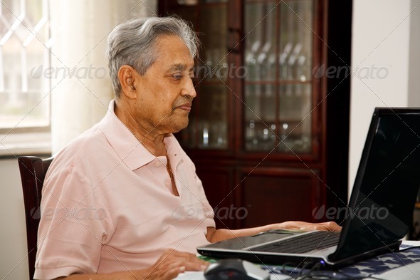 Old man using internet