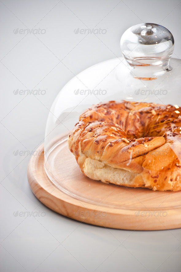 donut under glass dome. isolated on gray