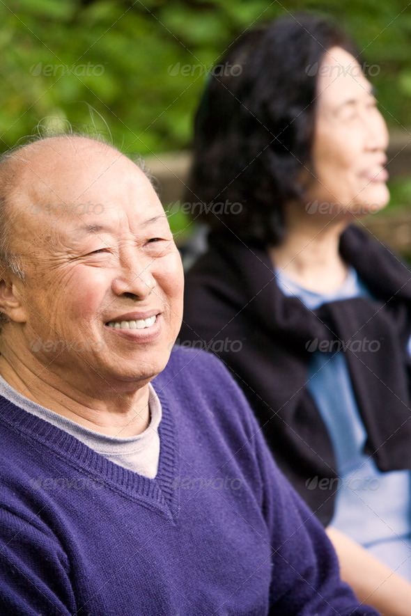 A shot of happy elderly asian couple outdoor