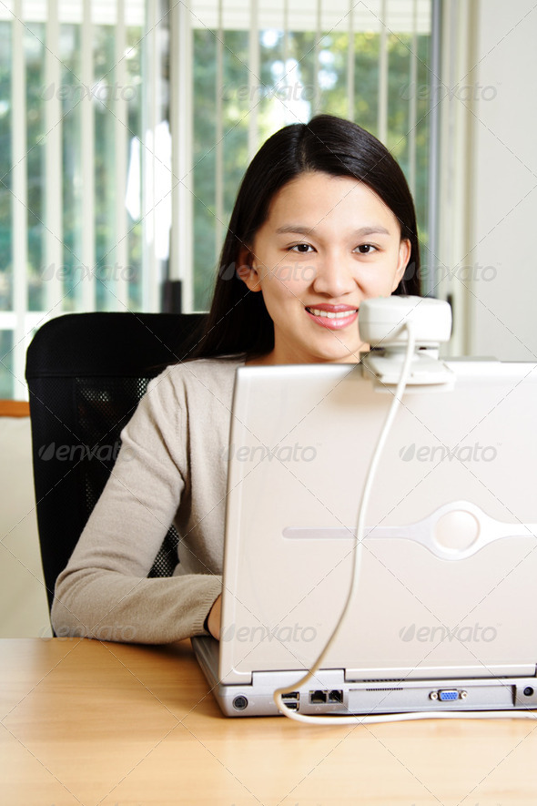 A businesswoman using webcam to communicate
