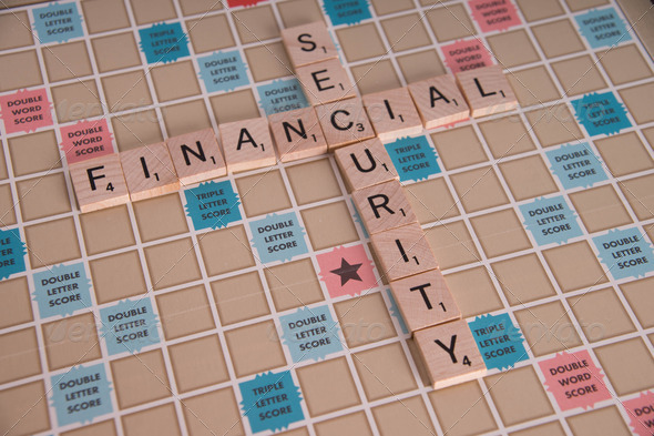 “Financial Security” concept spelled in Scrabble letters on Scrabble board