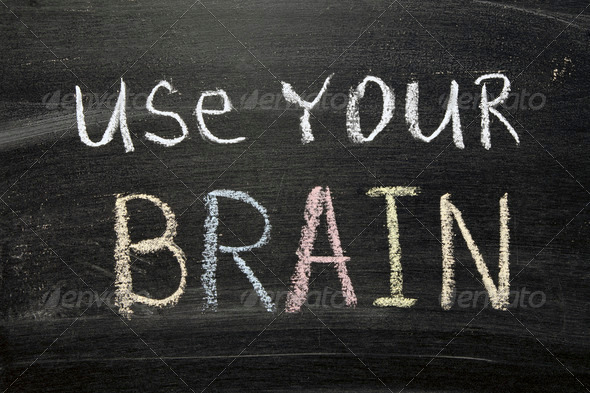 use your brain phrase handwritten on blackboard