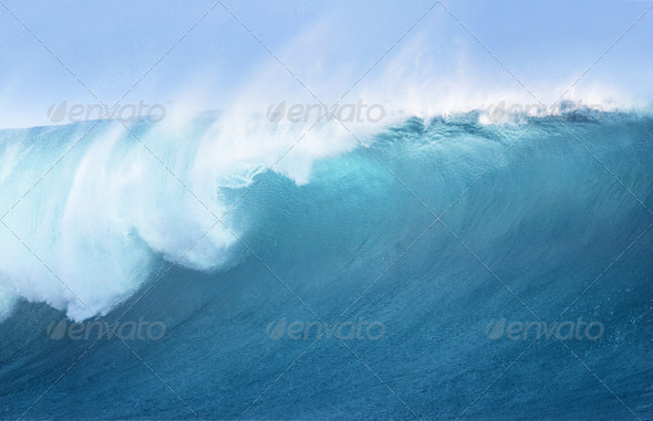 Large Blue Surfing Wave