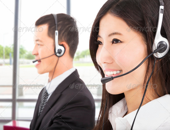 smiling asian businessman with call center agent