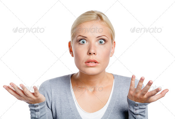 Worried woman spread hands and doesn’t know what to do, isolated on white