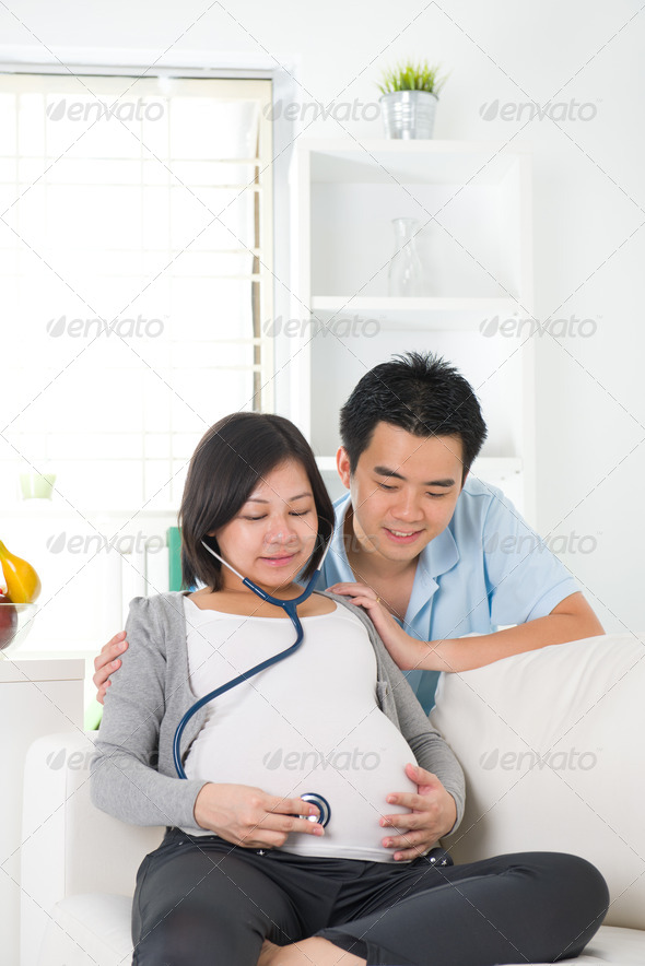 asian chinese pregnant couple lifestyle photo with living room a
