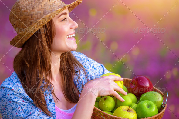 Happy woman with apples basket