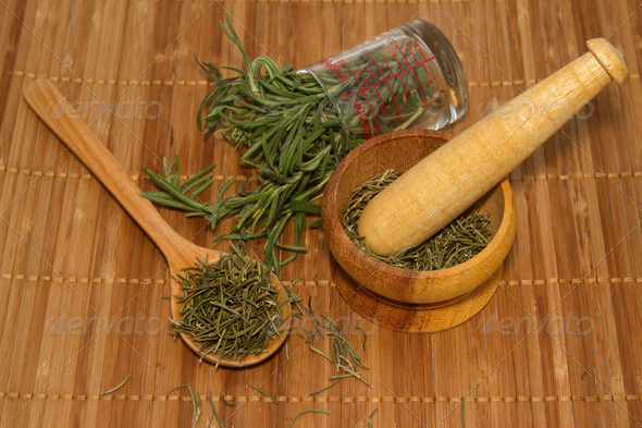 Rosemary product, mortar with fresh and dried rosemary