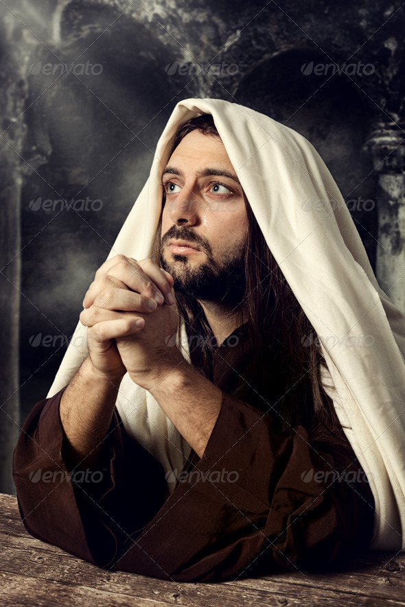Jesus praying and looking up to heaven while he cries