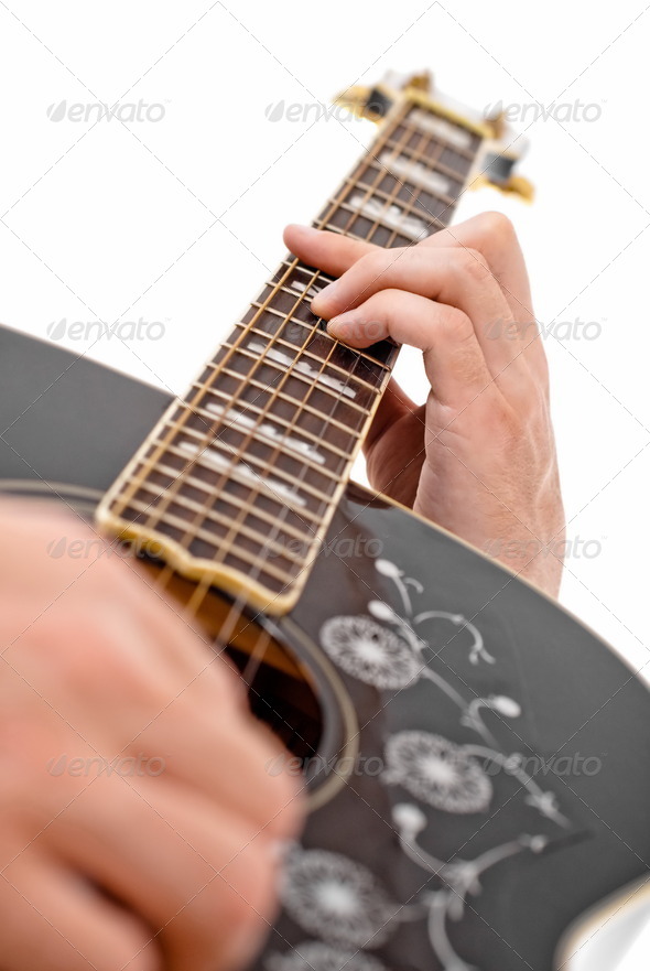 Hands playing guitar.