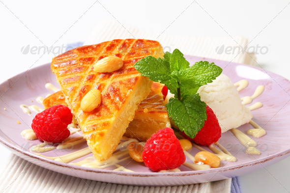 Almond cake with ice cream and fresh raspberries