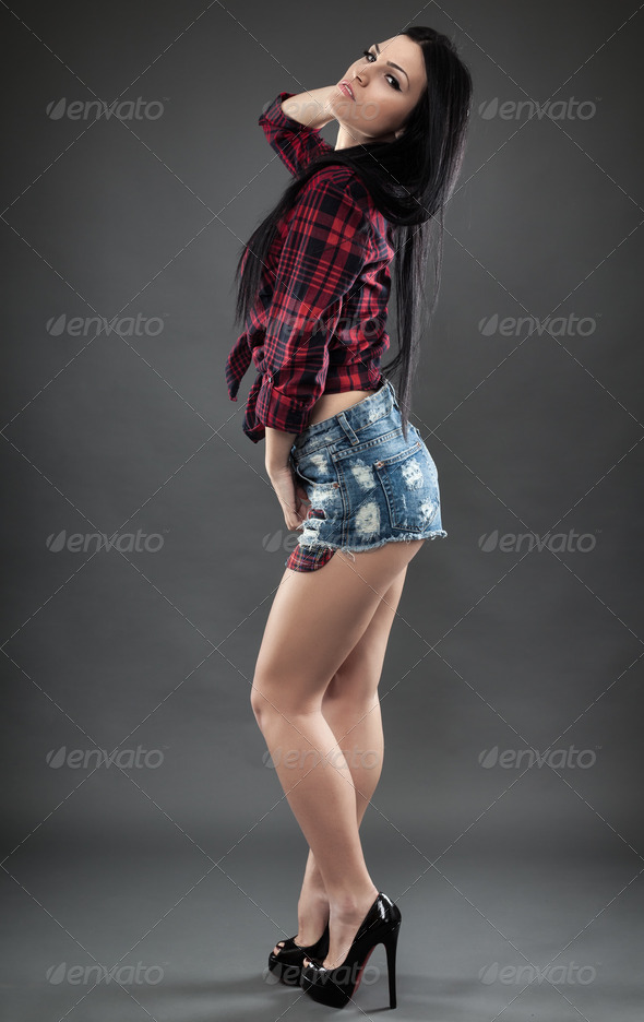 Full length of a latino woman in plaid shirt and shorts