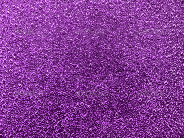 full frame abstract underwater background with lots of small air bubbles in violet ambiance