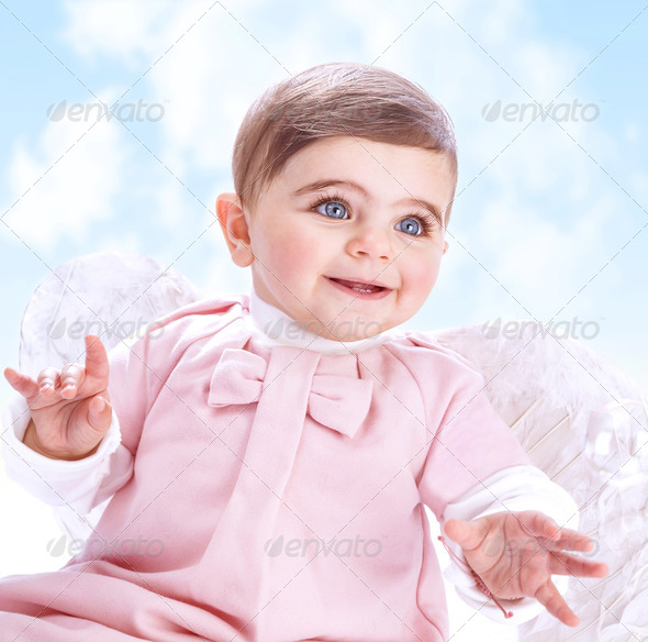 Little angel in heaven, adorable baby girl with white wings on blue cloudy sky background, innocence and purity concept