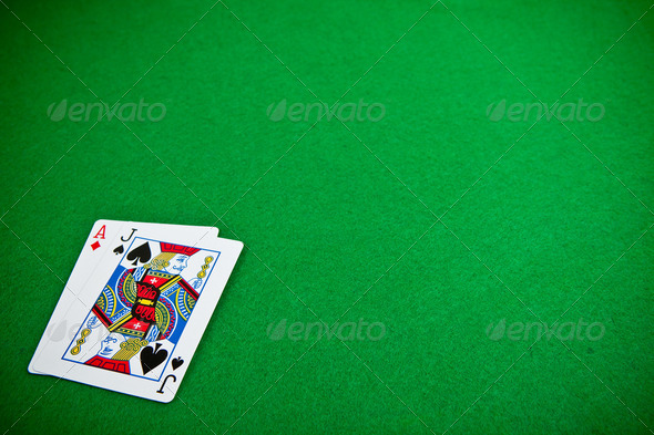 Cards over green poker table