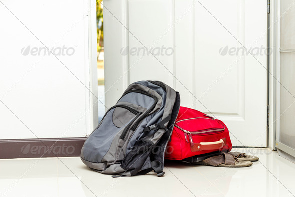 red travel bag , backpack and shoes